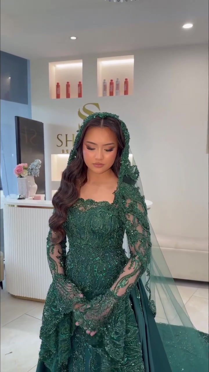 Horiah in an emerald gown