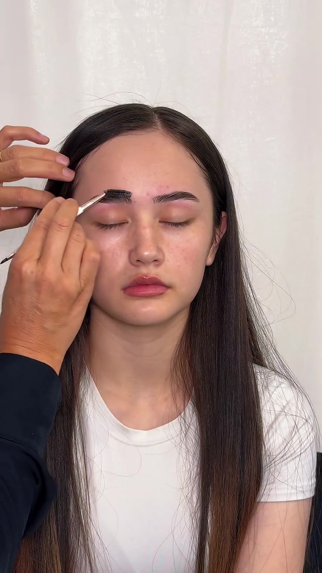 Brows being mapped and shaped in the lounge